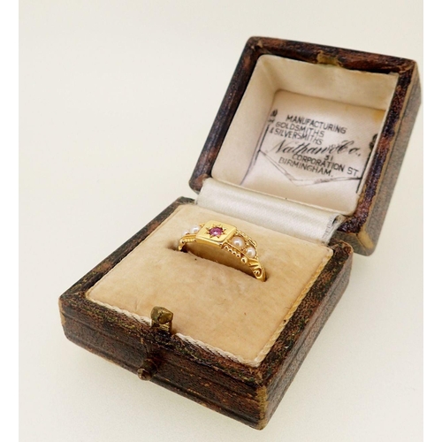 435 - An Edwardian 18 carat gold ring set ruby flanked by four seed pearls, 2.5g, size M - boxed