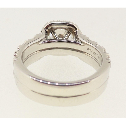 436 - A fine modern platinum ring set brilliant cut diamond within diamond surround, the band half set wit... 