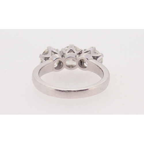 437 - A fine platinum set three stone diamond ring - approximately three carats in total, 7.8g