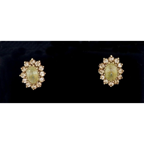 456 - A pair of gold oval citrine set earrings with paste surround (unmarked) 2.3g