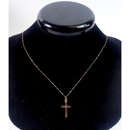 457 - A 9 carat gold crucifix and chain, 1.3g