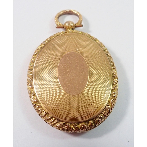 477 - A Victorian 9 carat gold oval locket with engraved decoration and glazed to verso, 9g, 4 x 3.3cm