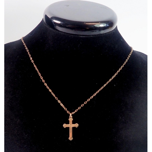 479 - A 9 carat gold crucifix and chain, 1.4g