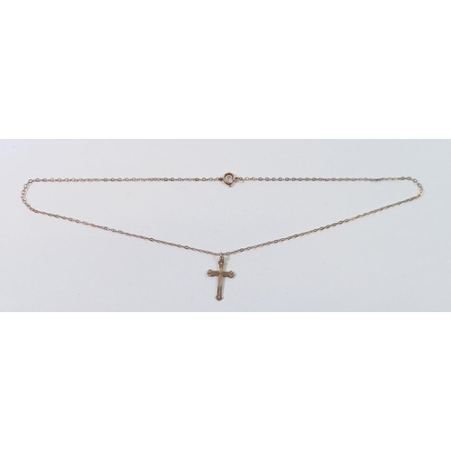 479 - A 9 carat gold crucifix and chain, 1.4g