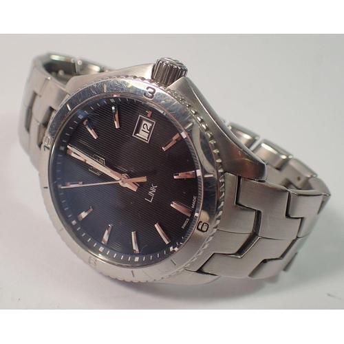 650 - A Tag Heuer gentlemen's Link wrist watch, stainless steel with black dial and date niche, boxed with... 