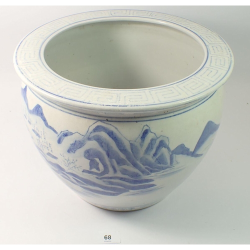 68 - A Chinese blue and white jardiniere painted landscapes 24cm tall