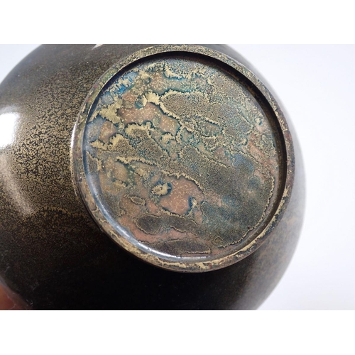 816 - A patinated metal vase with lustre finish, 22cm