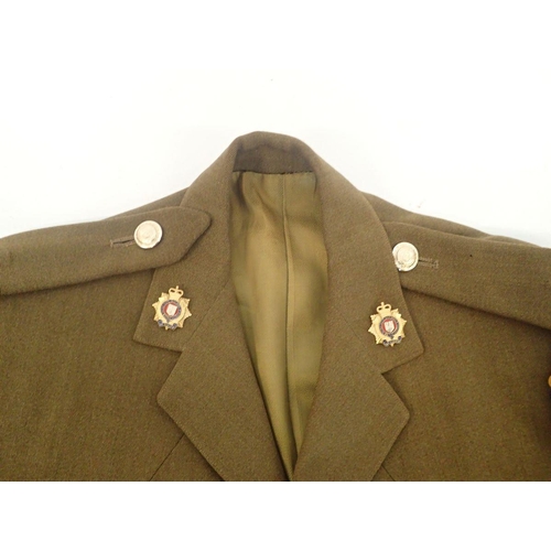 857 - An Army officers army jacket with Royal Logistics buttons, collar badges etc. by Moss Bros