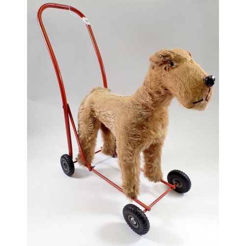 934 - A vintage Lines push along gold plush dog