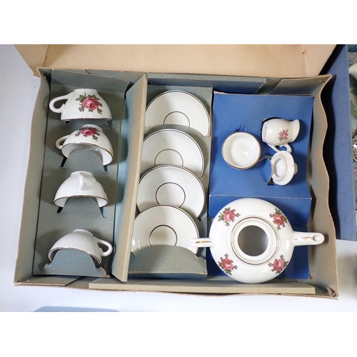 938 - A vintage children's chrome clad pottery tea service, boxed, another part children's tea set, boxed ... 