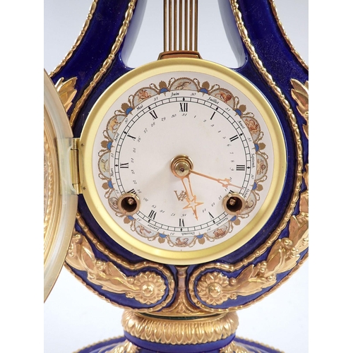 942 - A V&A Marie Antoinette porcelain lyre form mantel clock, 40cm