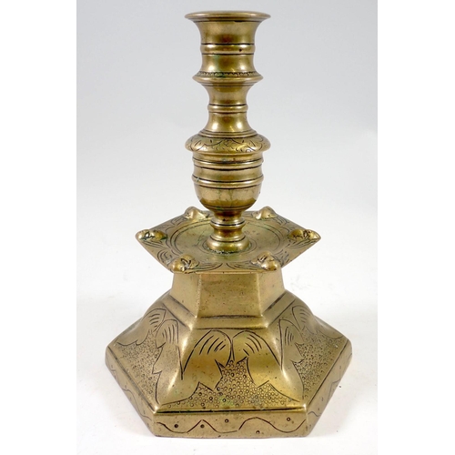 972 - A 19th century Dutch hexagonal brass candlestick with engraved decoration, 21cm