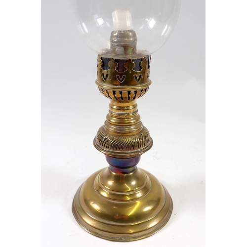 973 - A Victorian brass candle lamp with glass shade, 38cm