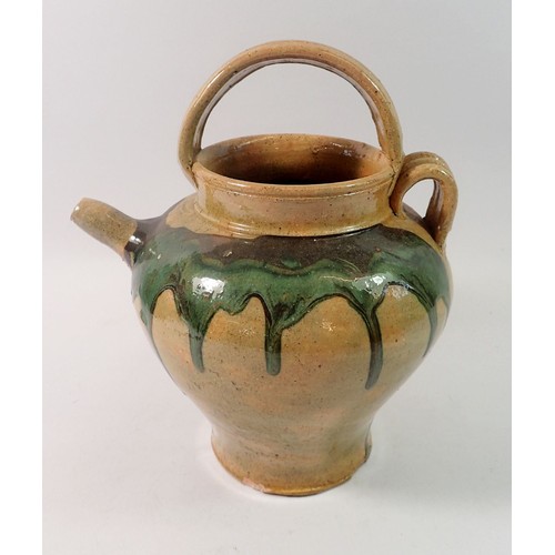 158 - A stoneware jug with green dribbled glaze, 24cm