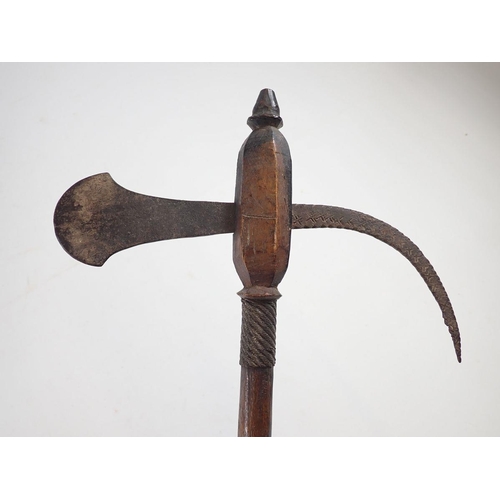 1000 - A short ceremonial war axe, 48cm and a carved paddle club, 49cm