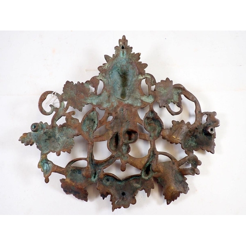 1005 - A 19th century cast brass pierced mask and vine plaque, 22 x 25cm