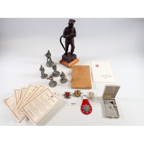 1015 - A group of English Miniatures fireman related figures, a figure of a fireman by R & V Green, 26cm ta... 