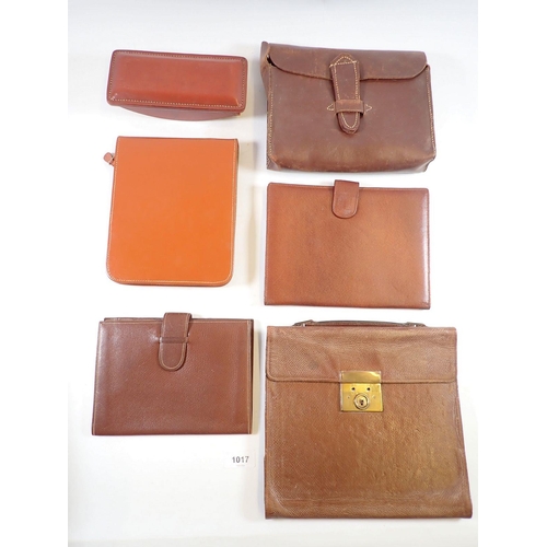 1017 - Four leather correspondence/wallets, a leather blotter and a leather pouch