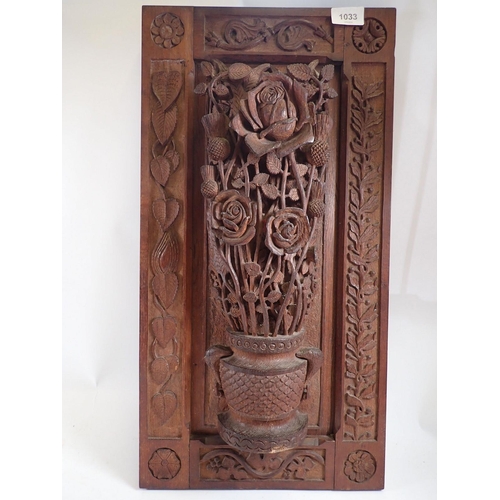 1033 - A carved oak openwork panel with roses and thistles, 58.5 x 30.5cm