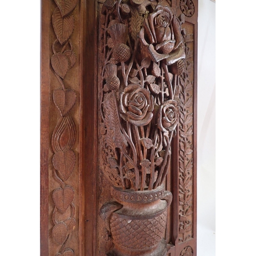 1033 - A carved oak openwork panel with roses and thistles, 58.5 x 30.5cm