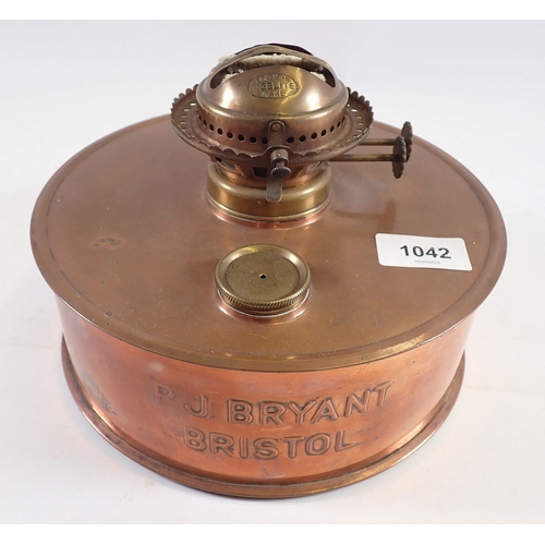 1042 - A copper oil lamp by P J Bryant of Bristol, 20cm diameter