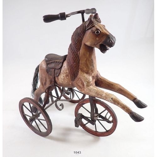 1043 - A miniature vintage velocipede horse, 37cm tall