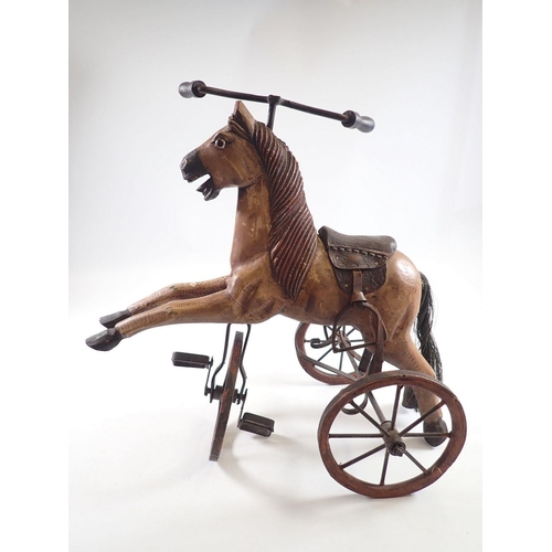 1043 - A miniature vintage velocipede horse, 37cm tall