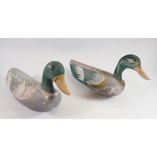 1044 - Two Folk Art painted wooden decoy ducks, 29cm long