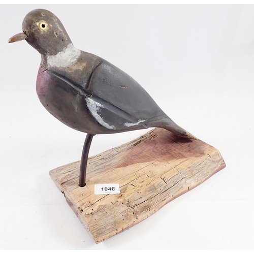 1046 - A mounted mid 20th century decoy pigeon with glass eyes, 28cm tall