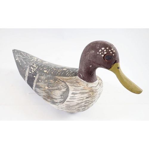 1047 - A Folk Art painted wooden decoy duck, 32cm long