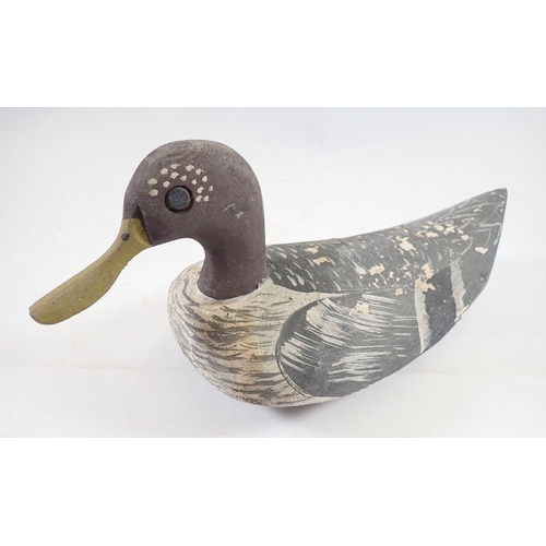 1047 - A Folk Art painted wooden decoy duck, 32cm long