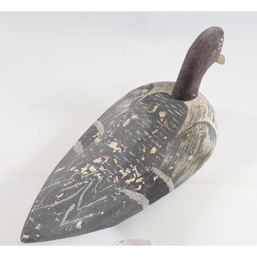 1047 - A Folk Art painted wooden decoy duck, 32cm long