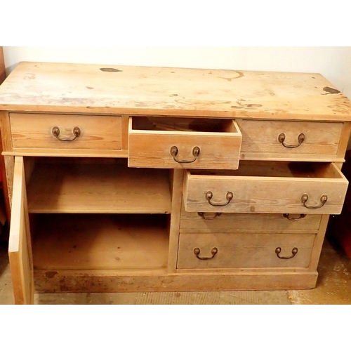 1048 - A 19th century pine side cabinet with three frieze drawers over cupboard and three further drawers, ... 