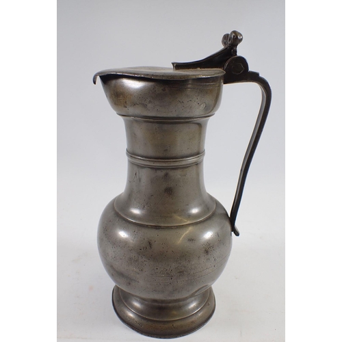 1057 - A large 18th century pewter flagon dated 1758 with touchmarks, 30cm tall