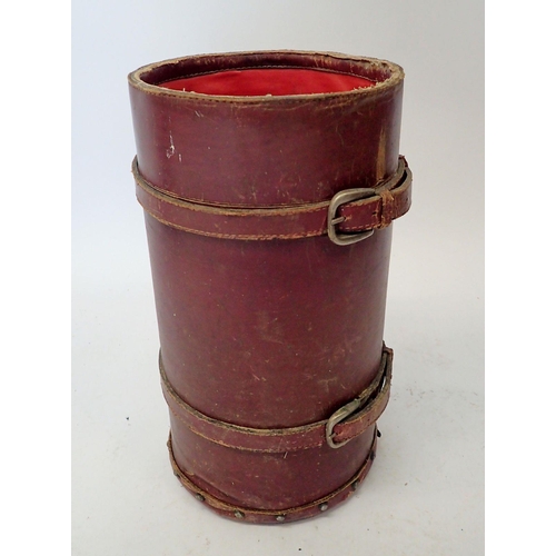 1058 - A leather stick stand made from shell holder, 41cm tall