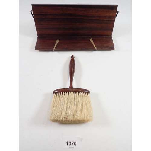 1070 - A rosewood bookrest and a rosewood hat brush