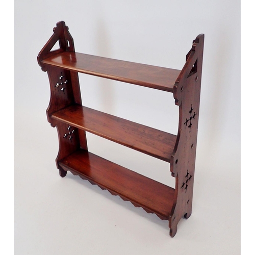 1075 - A Victorian mahogany set of wall shelves with pierced decoration, 56cm wide