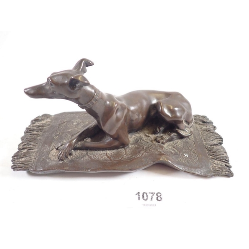 1078 - A bronze finish group recumbent whippet on rug, 19cm wide 'OFA' monogram