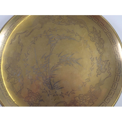 1080 - A Chinese brass engraved dish, 23cm diameter