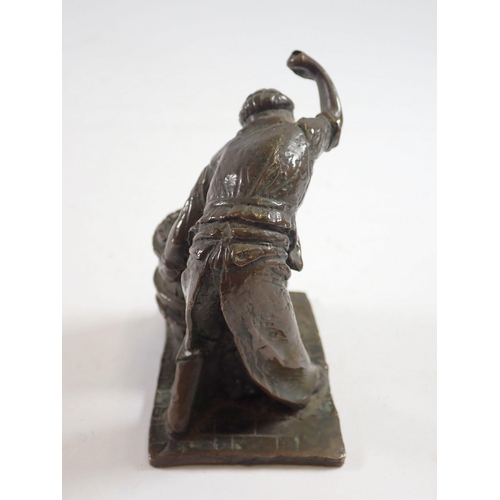 1081 - A small bronze figure of a barrel Cooper at work, 10cm tall signed Butler 77