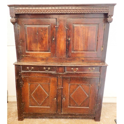 1096 - A 17th century oak court cupboard with two doors over drawers and two panelled cupboards, 140cm wide