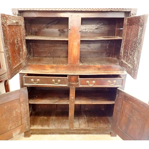 1096 - A 17th century oak court cupboard with two doors over drawers and two panelled cupboards, 140cm wide