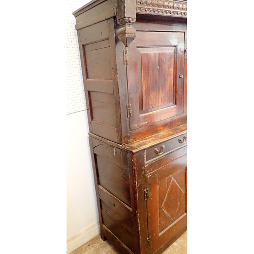 1096 - A 17th century oak court cupboard with two doors over drawers and two panelled cupboards, 140cm wide