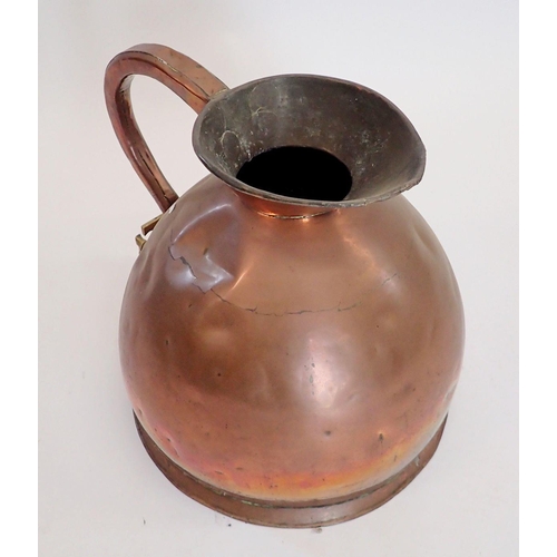 1098 - A large Victorian copper kitchen jug with brass tap fitted under handle, 38cm tall