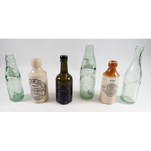 1111 - A group of stoneware and glass bottles including William Hall, Family Grocer, Monmouth and W Muncy, ... 