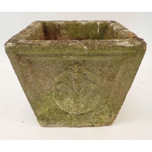 1118 - A square reconstitued stone garden urn decorated fleur de lys 33cm tall