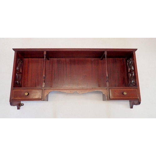 1123 - An Edwardian mahogany display shelf with pierced sides and two small drawers to apron, 84 x 35cm