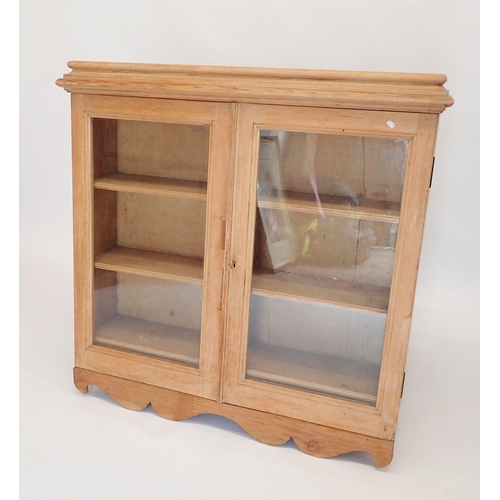 1127 - A 19th century pine glazed wall bookcase with three shelves and three small drawers within, 92 x 92 ... 