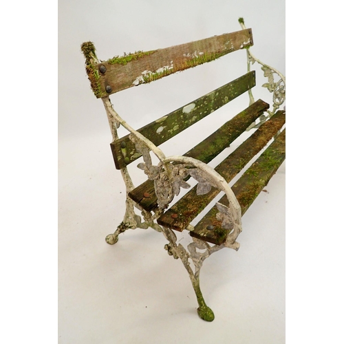 1128 - A Coalbrookdale style alluminium and wooden bench 121cm wide