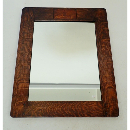 1135 - An early 20th century oak framed mirror with windmill marquetry, 62 x 49cm